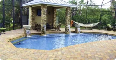 Pool deck around a stone-column cabana