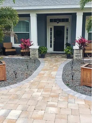 Curved paver front walkway with planters